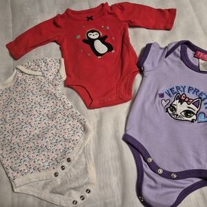 Bundle Of 3 Cute Bodysuits In Floral, Penguin and Purple Cat. Size 0-3 Months